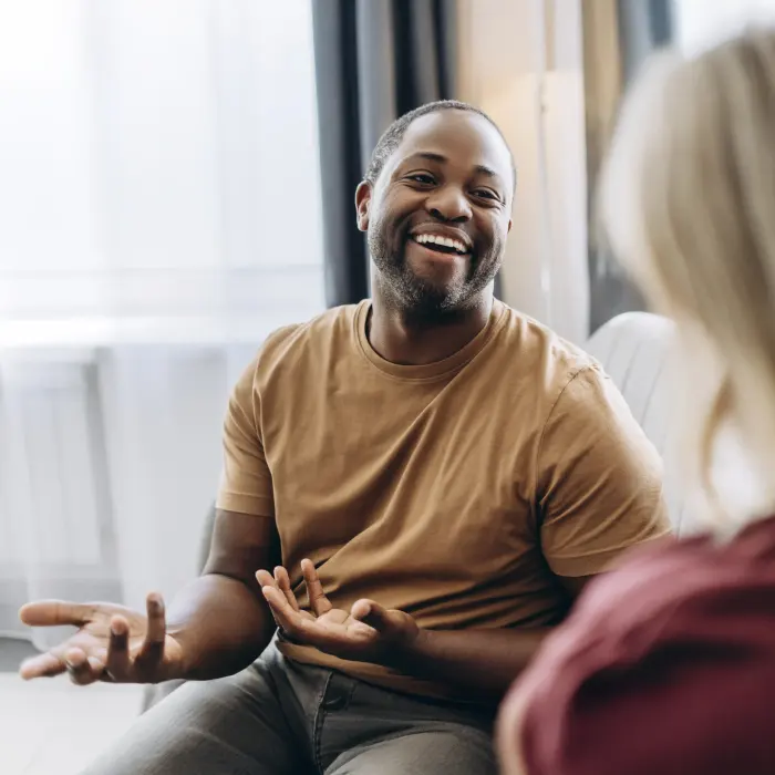 A patient talking with a provider during a psychiatric evaluation